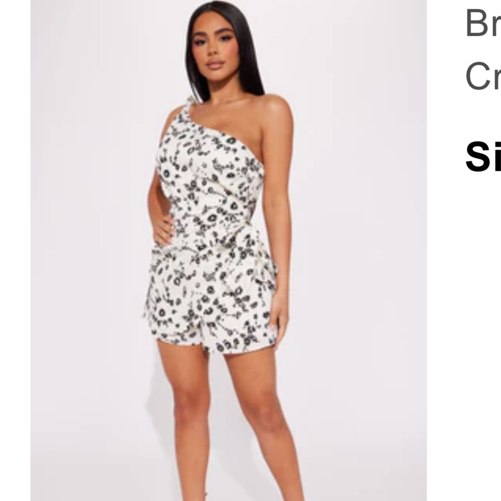 Blue and white floral romper never worn. Size Medium